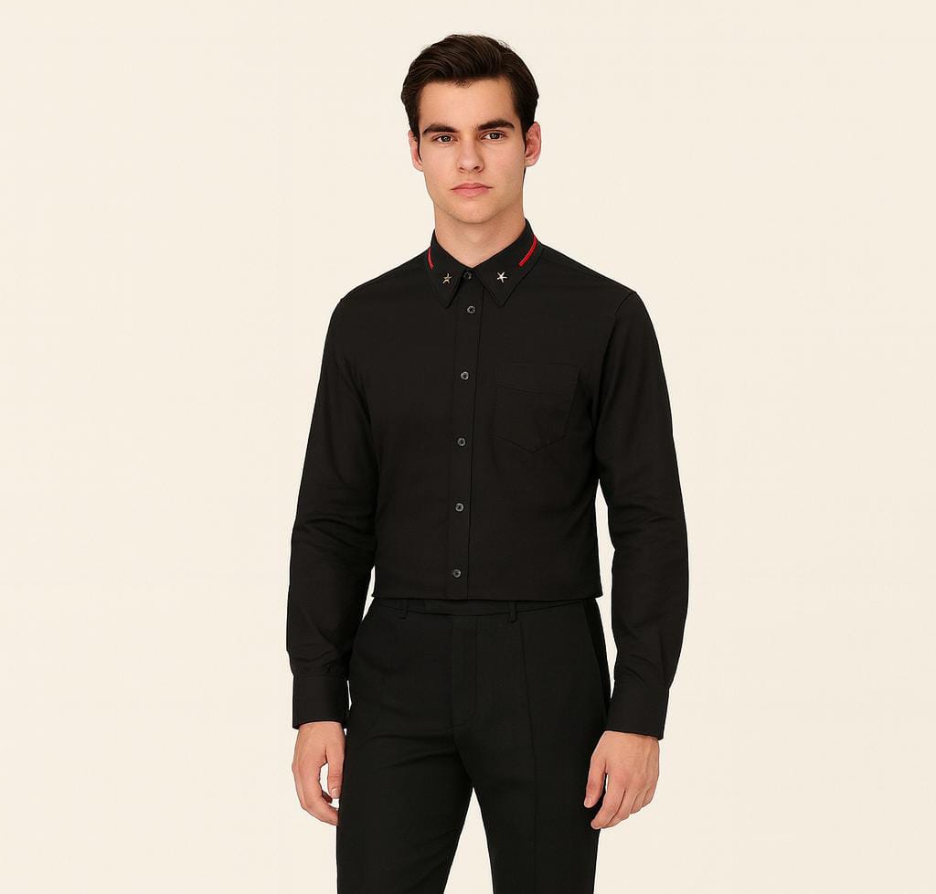 Man wearing a black dress shirt with red accents on a beige background